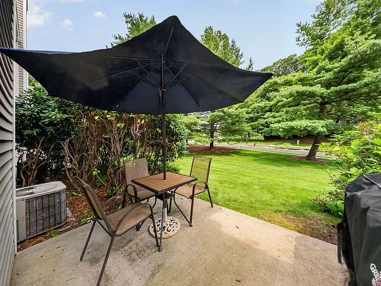 Large Private Patio Area Overlooking wide-open backyard lawn
