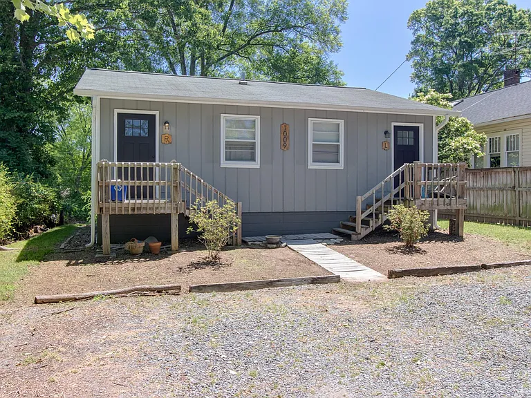 Back entrance with parking area.