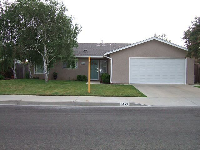 Front of home with newer roof, windows
