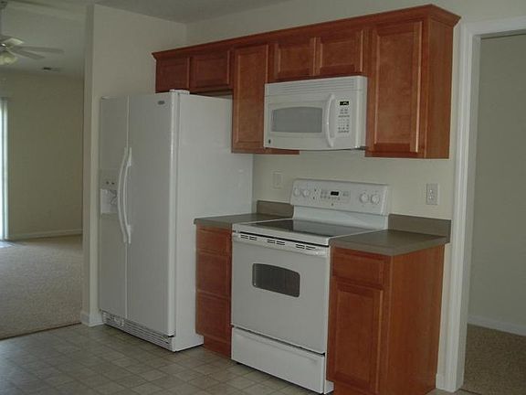 FRIDGE, OVEN AND MICROWAVE (living room to left and front door to right)