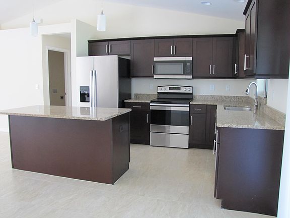 Kitchen with stainless steel appliances.