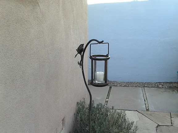 Sculptured candle holder in patio
