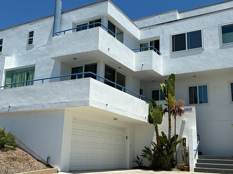 Mediterranean style architecture in small ideally located Lantern District TH style condominium community.