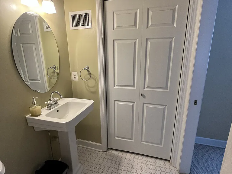 Third floor full bathroom with jacuzzi tub and storage closet