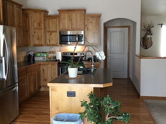 dining room looking into kitchen toward laundry room and gar
