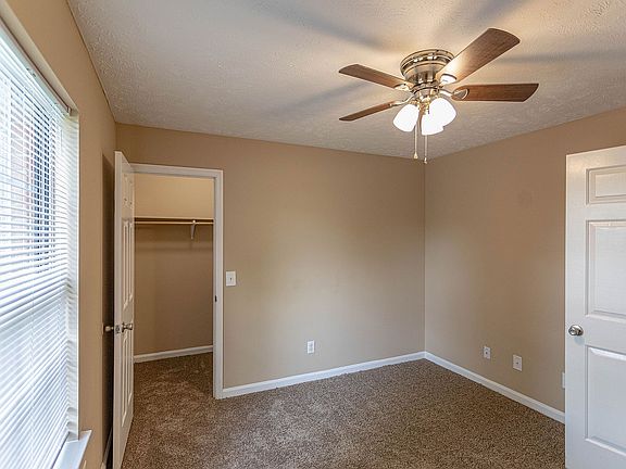 Bedroom with carpet & ceiling fan