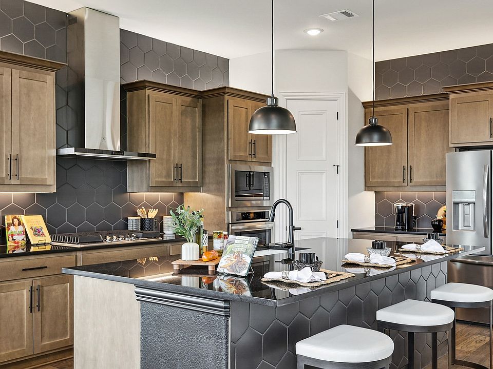 Elegant Morningside kitchen showcases chic hexagonal backsplash and refined wood cabinetry, creating