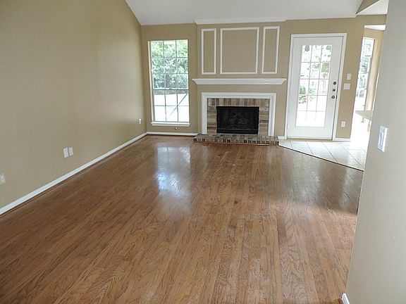 Rich Wood Floors in Den with Fresh Painted Walls!