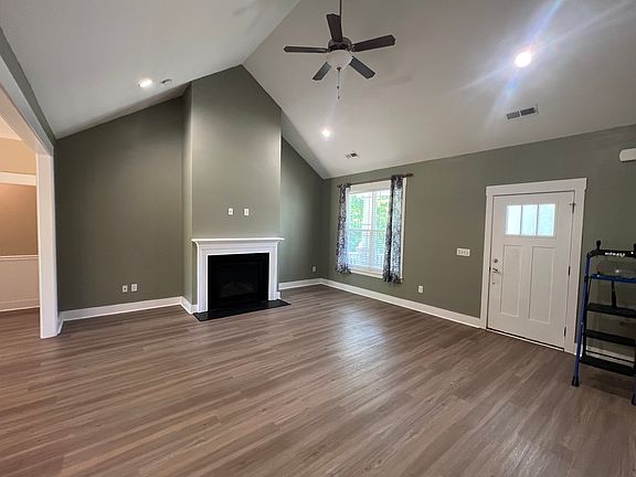 Stunning open-concept living with fireplace, gourmet kitchen views, and seamless backyard access. Pure perfection.