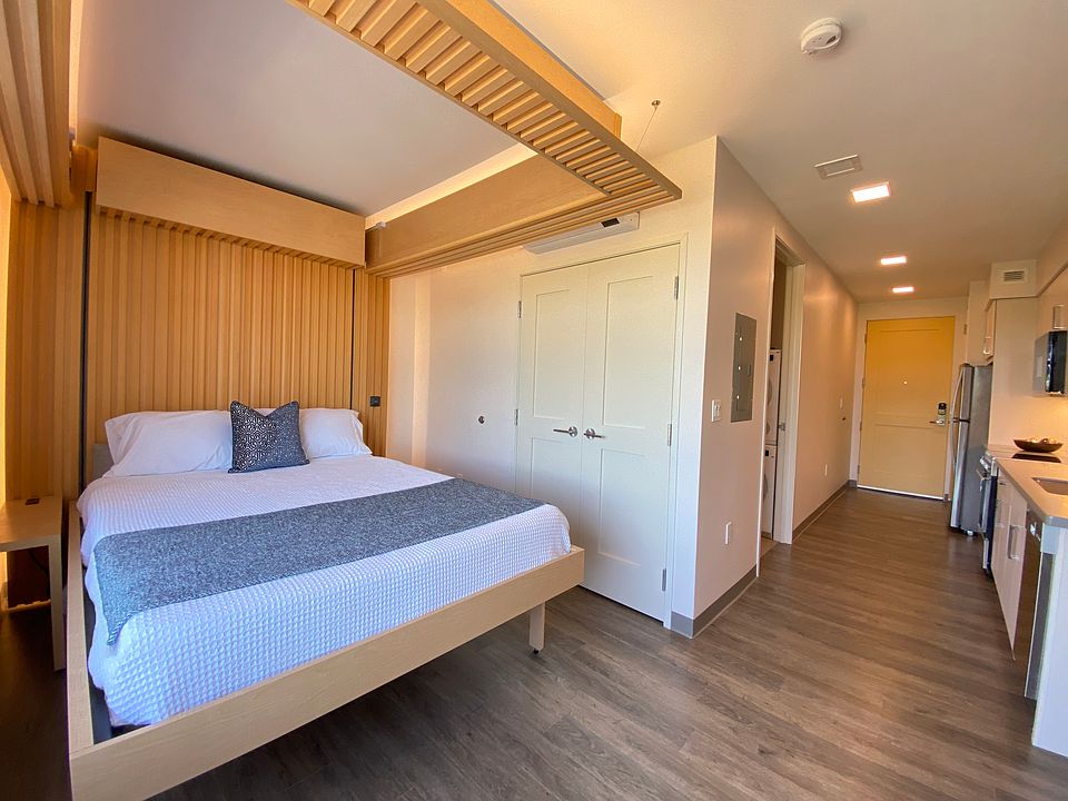 Partially Furnished apartment has a queen sized bed and sofa