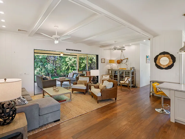 Large Living Room with screened in lanai overlooking backyard