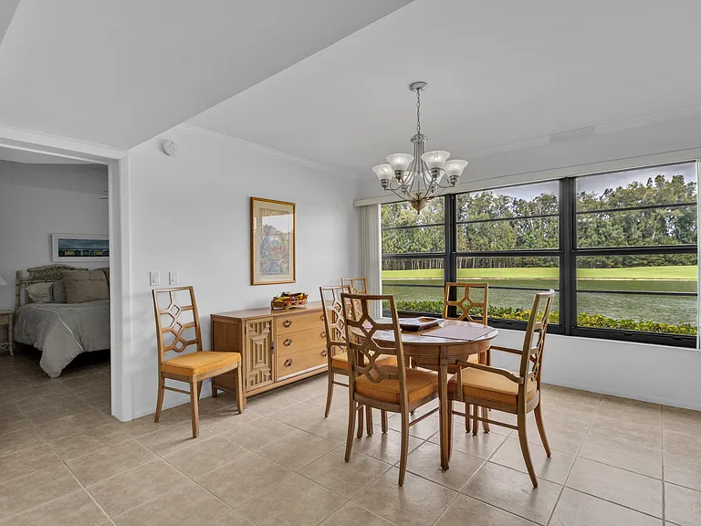 Dining area with lake and golf course views
