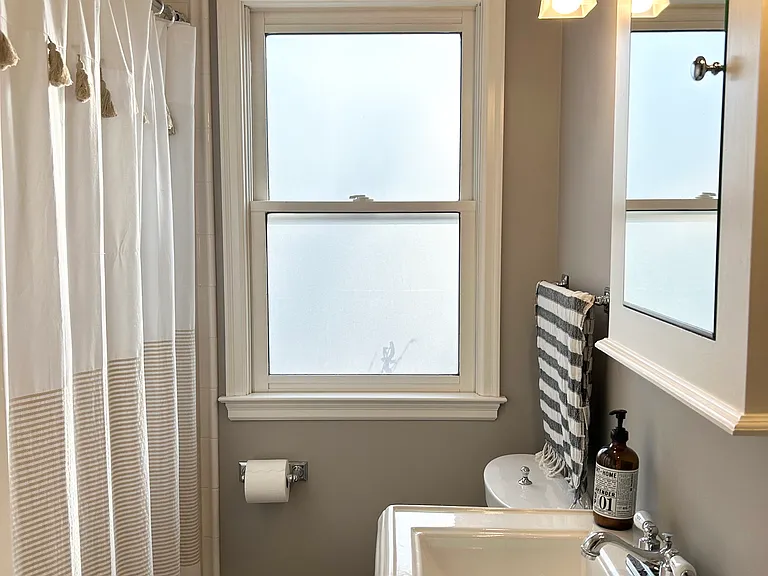 Main floor bathroom with a bathtub.