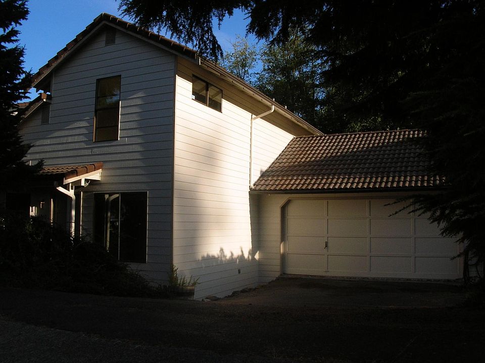 Front of house with attached two car garage.