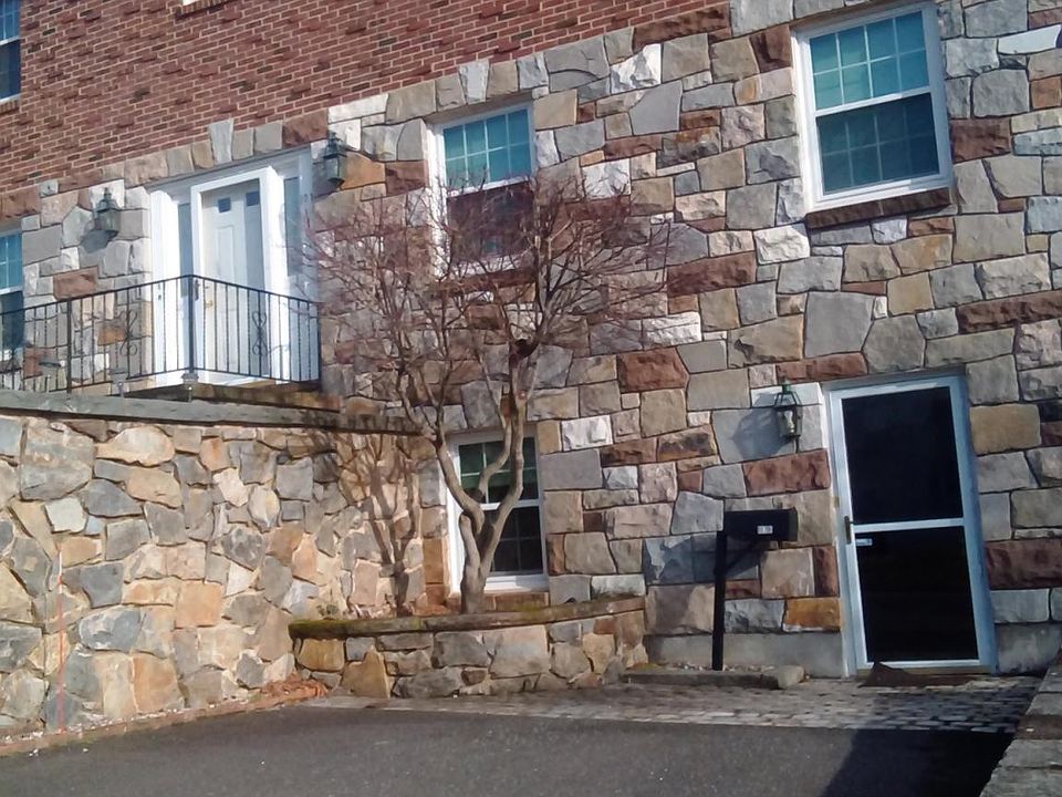 Front of apartment, showing private entrance and private dri