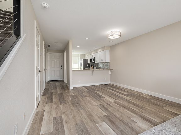 large living room with guest bathroom downstairs.
