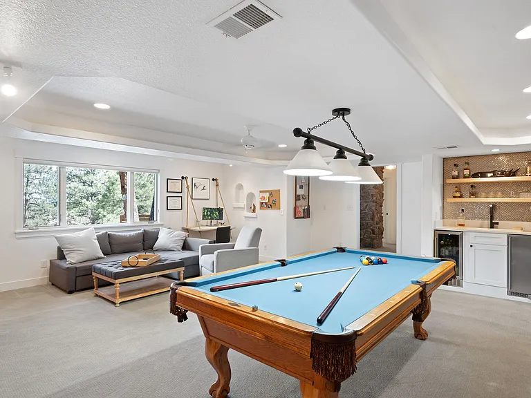 lower level family room. Shown is wetbar with 3 tap kegerator (currently 1 tap beer and 1 tap coldbrew coffee).