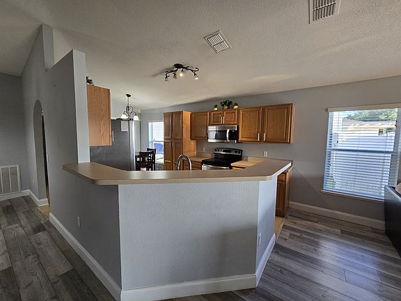 Kitchen complete with stainless steel appliances.