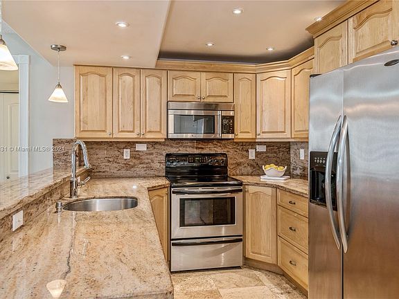 Open Kitchen with Granite Countertops & Backsplash