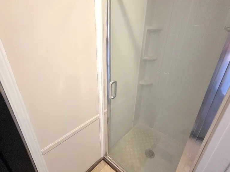Shower next to Master Bedroom with toilet and sink