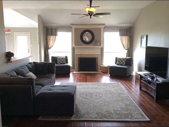 Open floor plan shows off family room with hand scraped hard