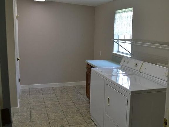 Huge laundry and craft room with storage closet
