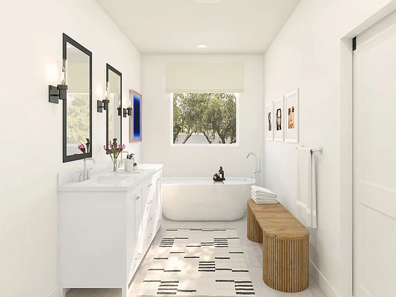 Primary bath with freestanding tub and glass shower enclosure