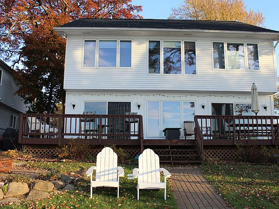 Lakeside with deck and yard