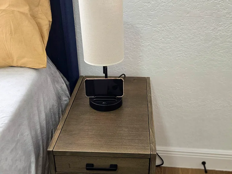Bedside lamp with USB and phone holder