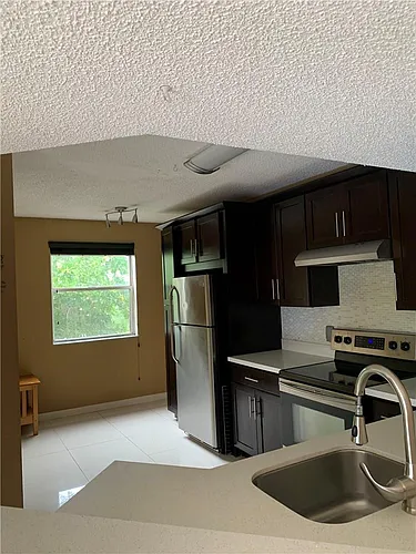 8891 Wiles Rd #308 Photo 1