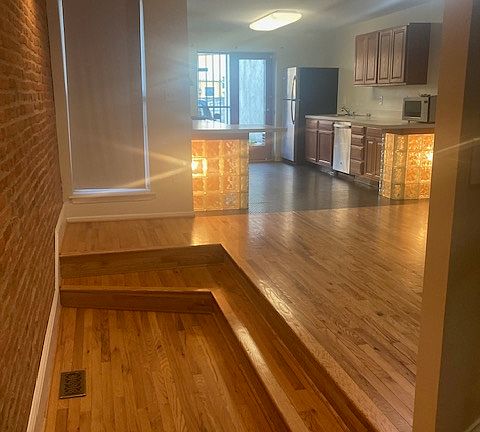 Dining Room & Kitchen with dishwasher, gas range, refrigerator & microwave. Full size Washer & Dryer in Basement.