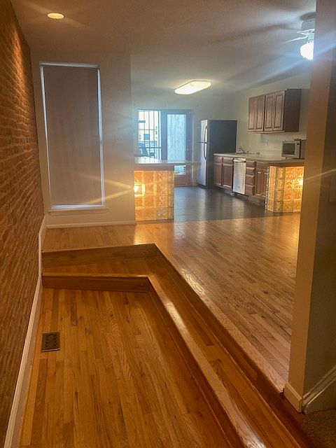 Dining Room & Kitchen with dishwasher, gas range, refrigerator & microwave. Full size Washer & Dryer in Basement.