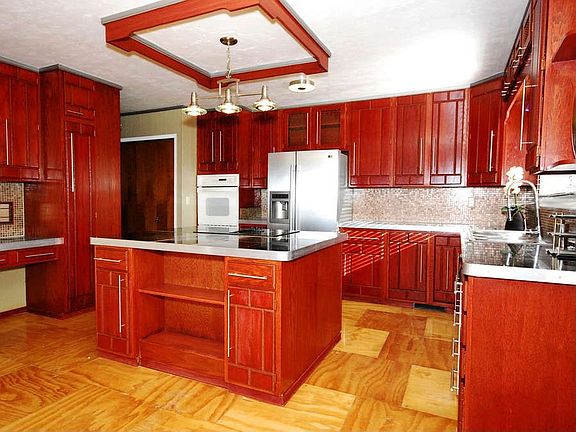 "The kitchen features hardwood floors, granite countertops and tons of cabinet space."
