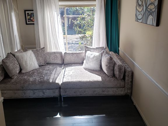 Stairs lead to drop living room.