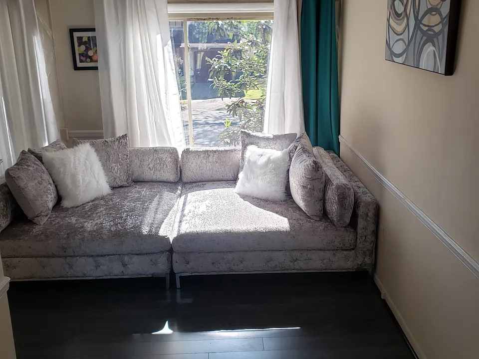 Stairs lead to drop living room.