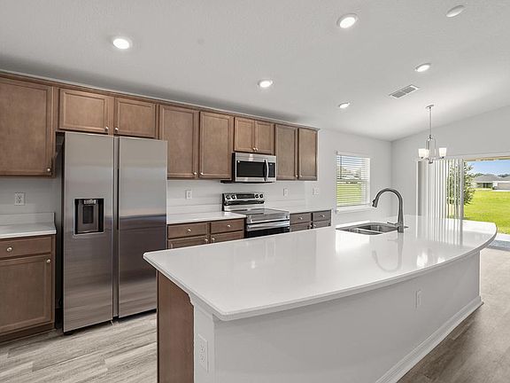 Your bright, open kitchen includes quartz, 36-inch cabinets, and Samsung SS appliances.