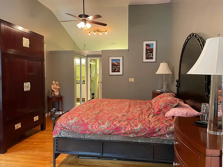 Beautiful Master room with walk in closets and furniture. Desk overlooking the beautiful garden and lake.