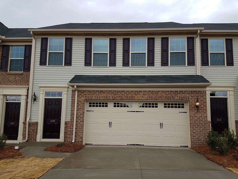 Main entrance with adjacent 2 car garage
