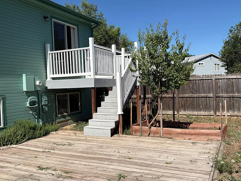 View from Deck of Yard and up to Bedroom 1