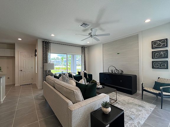 Ashley townhome exterior with covered porch in Pine Meadows, new construction in Eustis FL