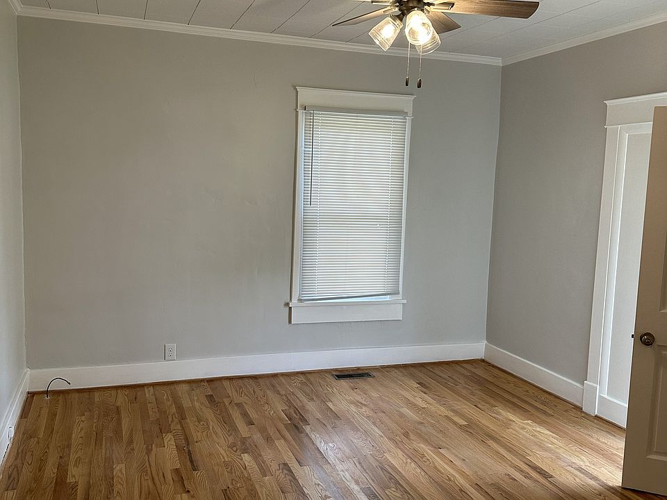 Large living room with ceiling fan.
