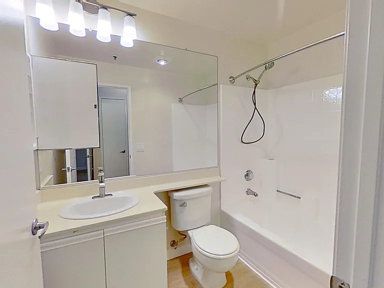 En-suite bathroom in primary bedroom of apartment #213