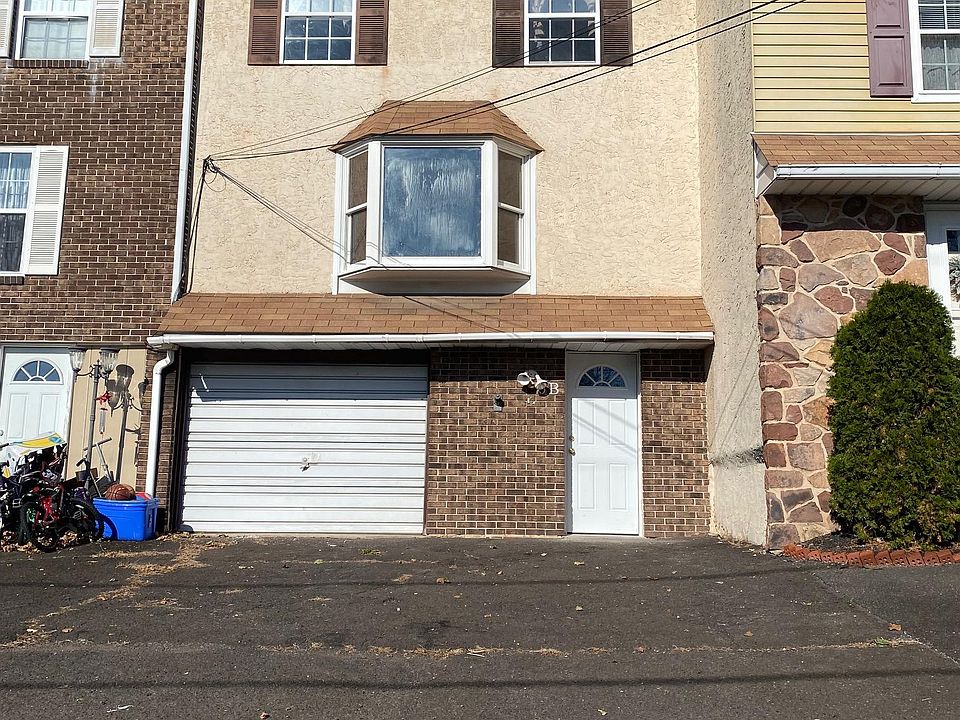 Front view with garage and outside parking