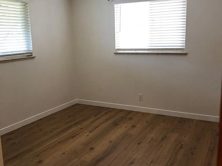 Bedrooms have blinds for privacy and ceiling fans for comfort.