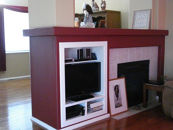 Fireplace to two Lv Rms.