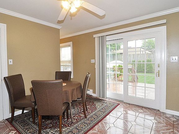 Spacious Dining Area Overlooking Landscaped Backyard