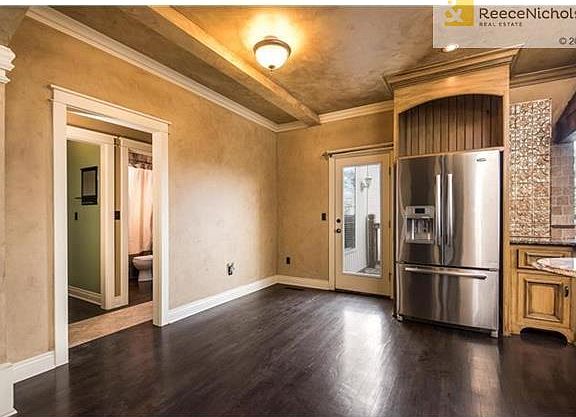 Stainless steel refrigerator stays with the property.