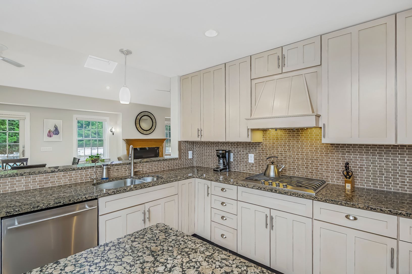  Kitchen features stainless steel appliances & writing desk