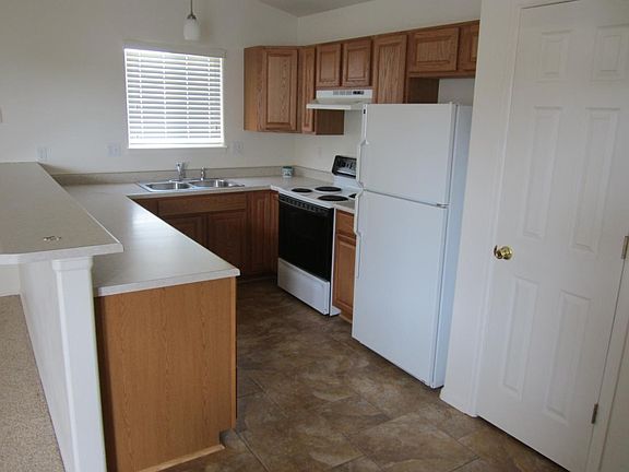Tiled kitchen with newer cabinets