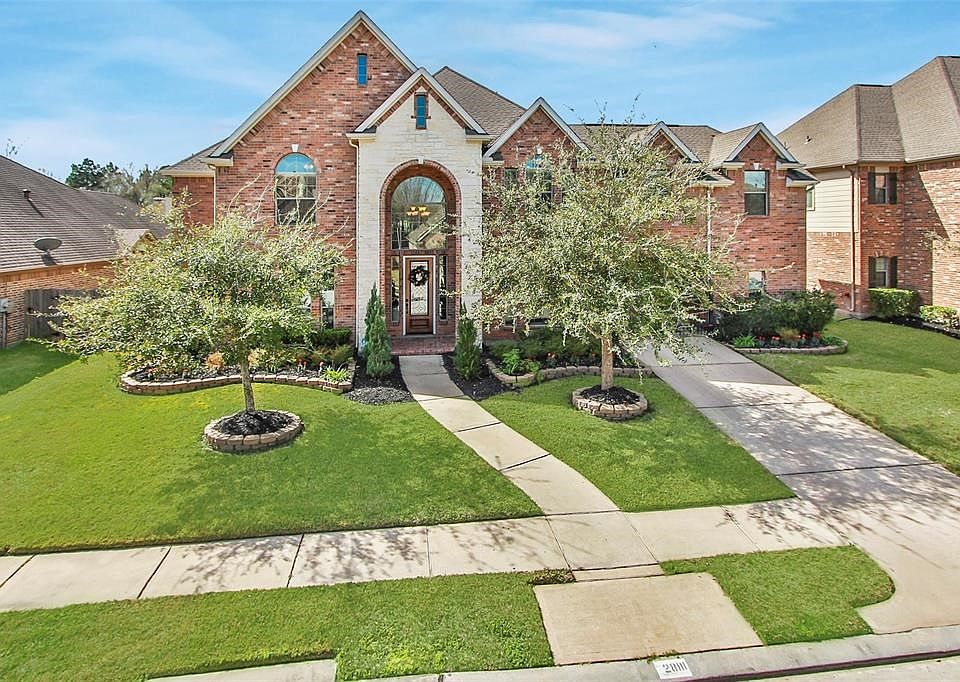 Welcome Home to 28111 Cade Hills Lane located in the gated section of Spring Trails.